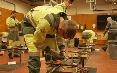 Apprentices practicing their craft in a workshop.